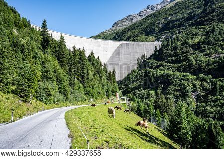 Huge Concrete Apline Dam On Sunny Summer Day. Zillergrundl Speicher, Zillertal Alps, Austria