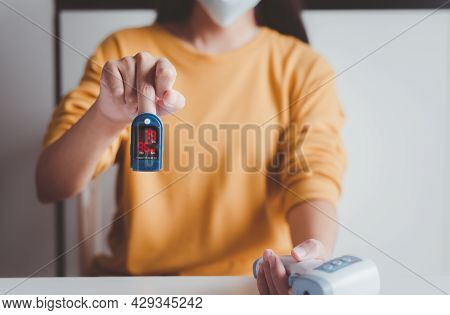 Patient Woman Using Fingertip Pulse Oximeter Oxygen Saturation Meter Spo2 Pr Blood Monitor Finger At