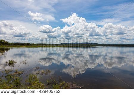 Water Mirror Effect On The Minneriya Wewa Lake At The Minneriya National Park , Sri Lanka. Cloudscap