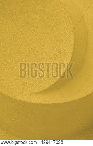 Abstract Stone Sculpture Concrete Yellow Color. Embossed Concrete Architectural Detail