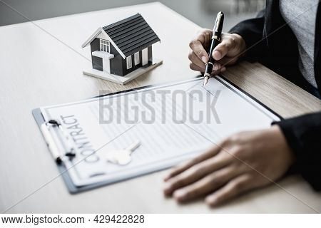 The Salesperson Is Checking The Contract Before Making An Appointment For The Customer To Join The C
