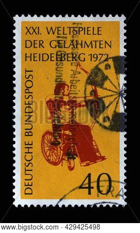 ZAGREB, CROATIA - SEPTEMBER 11, 2014: Stamp printed in Germany showing Wheelchair archery, 21st International Games for Paralysed, Heidelberg, circa 1972