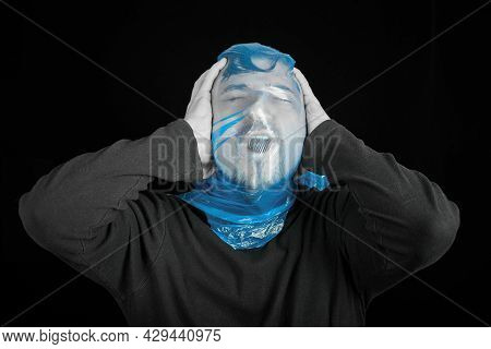 Blue Garbage Bag On Man Head. Exit Bag For Suicide. Self-asphyxiation Concept. Suicide Bag On Man He