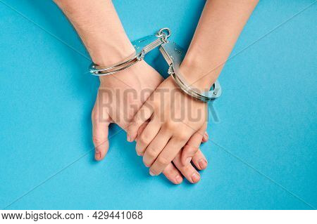 Male And Female Hands In Handcuffs. Love Forever. Prenuptial Agreement, Duties Of Love Couple.