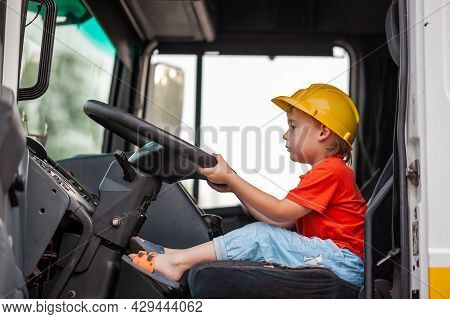 Little Boy Driving Tractor. Son Helps Father To Repair Tractor. Involve Child In Work