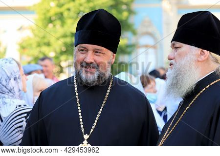 Orthodox Priests In Church Clothes Stand On The Street In Kiev. A Religious Rite, A Holiday At A Chr
