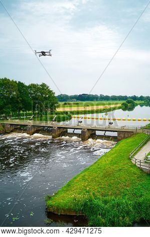 An Aerial View With A Flying Drone In The Background Above A Weir In The River Vecht. Lock Keepers H