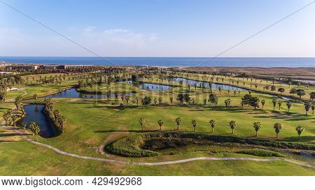 Green Golf Courses By The Sea. Salgados Beach. Portugal, Albufeira. Aerial View And Trees