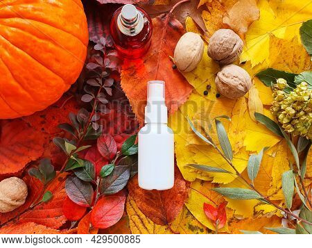 White Cosmetic Spray Bottle, Red Perfume Bottle, Pumpkin, Magic Lights And Bright Autumn Leaves. Nat