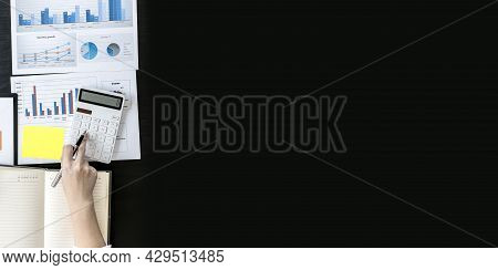 Top View Woman Pressing A White Calculator And Holding Money, She Is Keeping A Personal Account By R