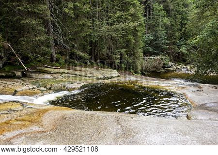Certova Oka Geological Formation And Lake In Krkonose (giant Mountains) In The Mumlava River, Czech 