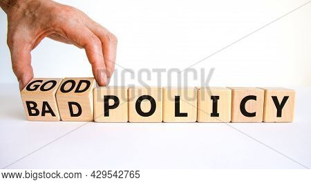 Good Or Bad Policy Symbol. Businessman Turns Wooden Cubes And Changes Words 'bad Policy' To 'good Po