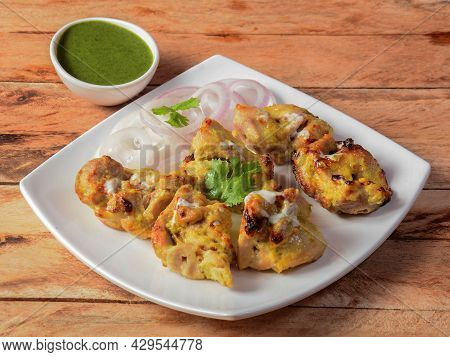 Assorted Indian Food Chicken Reshmi Kebab Served On Wooden Background. Dishes And Appetizers Of Indi