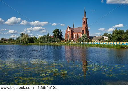 Old Ancient Church Of St Anthony Of Padua By River In Postavy, Vitebsk Region, Belarus.