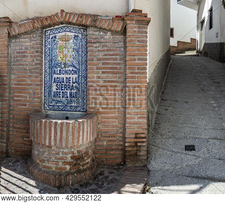 Fountain Of The Town Of Albondón De Granada Made Of Granada Ceramics And Red Brick Next To A Steep S
