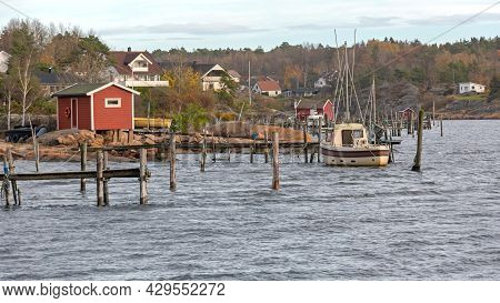 Wooden Cabin And Fishing Boat At Hvaler Island Norway