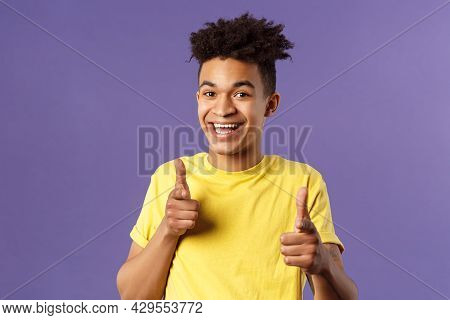 Believe In You. Portrait Of Cheerful Young Optimistic Guy Encuraging To Keep Going, Pointing Fingers