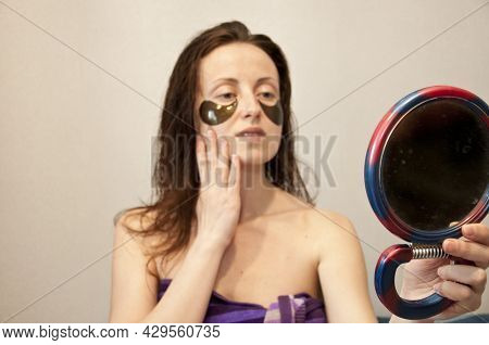 Facial Collagen Cosmetic. Moisturizing Skin. Cosmetology. Young Woman In Terry Towel Use Patch. Beau