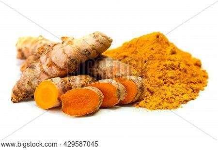 Turmeric Rhizome And Powder On White Background