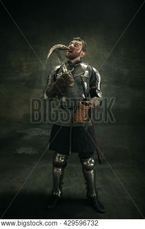Portrait Of One Brutal Bearded Man, Medeival Warrior Or Knight Over Dark Background.