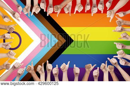 lgbtq, trans and intersex rights concept - multiracial human hands showing thumbs up over rainbow progress pride flag on background