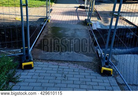 Installation Of Hot Water Pipes For Heating Apartments. Insulated Pipes Are Laid In The Road For San