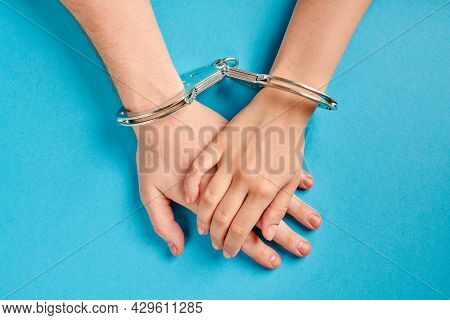 Love Forever. Male And Female Hands In Handcuffs. Prenuptial Agreement, Duties Of Love Couple.