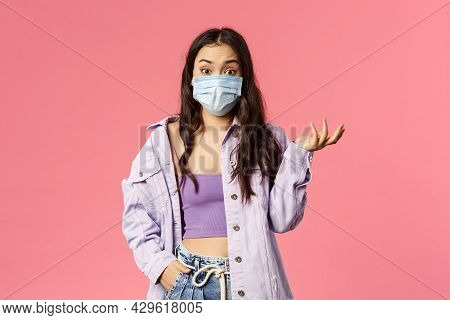 Covid19, Quarantine, People Concept. Surprised Young Woman In Medical Face Mask Stay Safe During Cor