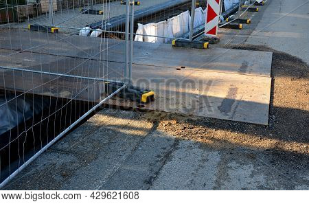 Installation Of Hot Water Pipes For Heating Apartments. Insulated Pipes Are Laid In The Road For San