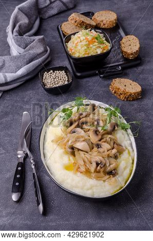 Mashed Potatoes With Butter, Fried Mushrooms With Onions And Salad Of Fresh Vegetables On A Gray Cem