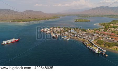 Aerial View Ferry Port Gilimanuk With Ferry Boats, Vehicles. Ferries Transport Vehicles And Passenge