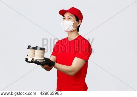 Here Is Your Order, Have Nice Day. Friendly Smiling Delivery Man, Fast-food Employee, Extend Hands A