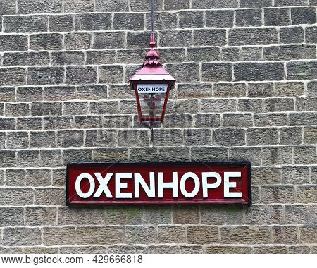 Oxenhope, England - June 24:  A Destination Sign And Traditional Lantern At Oxenhope Station On The 