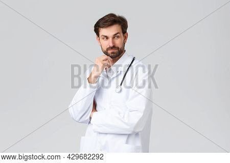 Hospital, Healthcare Workers, Covid-19 Treatment Concept. Professonal Doctor, Physician In White Scr