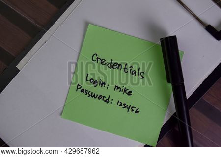 Credentials, Login And Password Write On Sticky Notes Isolated On Wooden Table.