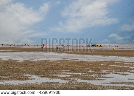 Taean, South Korea; July 30,2021: Landscape Of Beach At Low Tide With People Enjoying Water Activiti