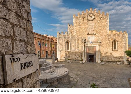 Church of San Nicola located on Piazza del Duomo in old town of Taormina, Sicily, Italy. Vico Ebrei street name sign at foreground. Sicilian travel destination