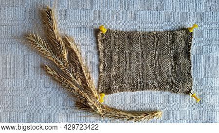 Composition Of Knitted Linen And Rye Ears On A Self-woven Tablecloth