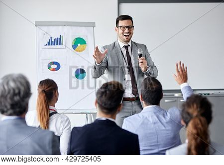 Young Busnessman Having A Speech By A Whiteboard During A Conference Business Meeting In An Office. 