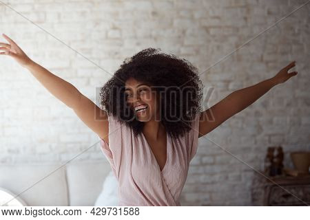 A Satisfied Mixed-race Woman Enjoys Rhythmic Movement
