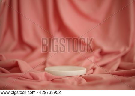 White Marble Podium On The Pink Background. Podium For Product, Cosmetic Presentation. Creative Mock
