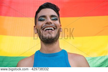Happy Homosexual Man Celebrating Gay Pride Holding Rainbow Flag Symbol Of Lgbtq Community
