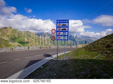 Welcome To Italy At Timmelsjoch High Alpine Road In The Austrian Alps - Timmelsjoch, Austria - July 