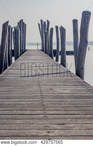 Straight Wooden Bridge With Wooden Posts As Fence Heading To The Atoll, Woldstrand Zeewolde Beach Re