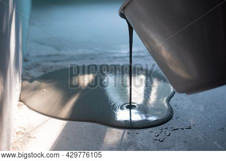Restoring Or Leveling The Floor In The Apartment With Self Leveling Compound Spreading