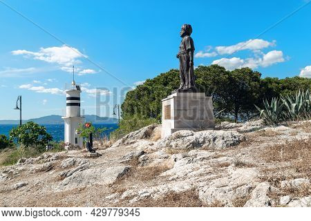 Kusadasi, Turkey - June 2, 2021: Monument To Admiral Aruj Barbarossa And The Lighthouse Of The Pigeo