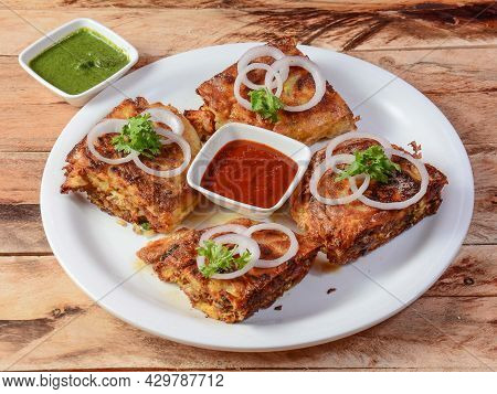 Chicken Baida Roti, Isolated Over A Rustic Wooden Background, Selective Focus