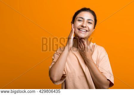 Close Up Portrait Of Young Indian American Woman Doing Facebuilding Yoga Face Gymnastics Yoga Self M