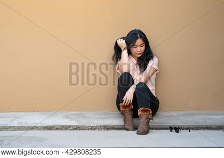Asian Woman Is Sitting Alone On The Rooftop Of Building With Tried And Disappointed Mood And Tone In