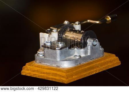 Details Of A Miniature Music Playing Hurdy-gurdy